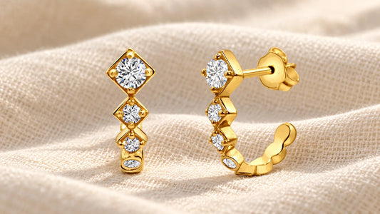 Gold-plated Sparkling Squares Huggies with sparkling stones on light linen