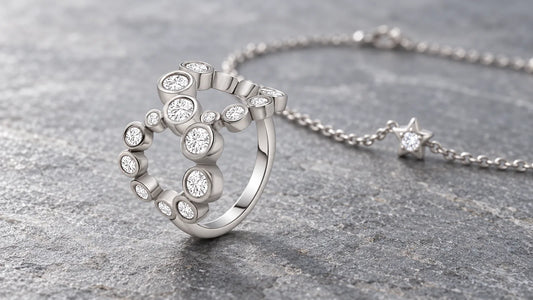 Infinity Ring and Star Bracelet in sterling silver on grey slate