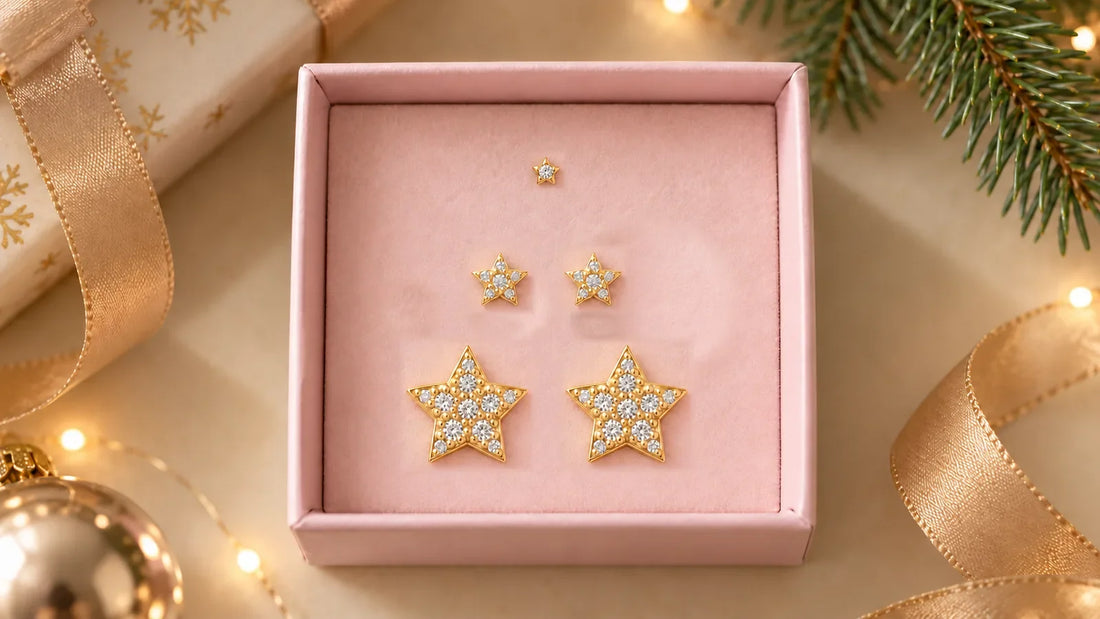 Star Trio Set with gold-plated star studs in a jewelry box with Christmas decorations